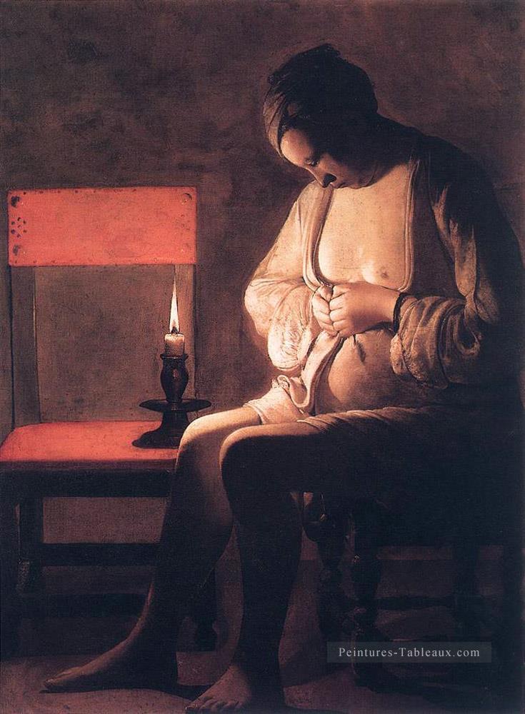 Femme Attrapant des puces chandelles Georges de La Tour Peintures à l'huile